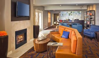 The hotel’s lobby lounge features a fireplace and widescreen TV, plus comfortable seating and coffee tables.