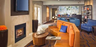 The hotel’s lobby lounge features a fireplace and widescreen TV, plus comfortable seating and coffee tables.