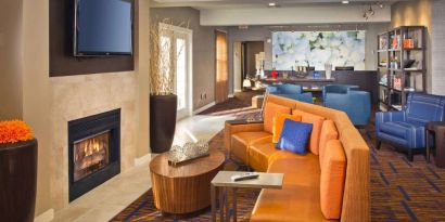 The hotel’s lobby lounge features a fireplace and widescreen TV, plus comfortable seating and coffee tables.