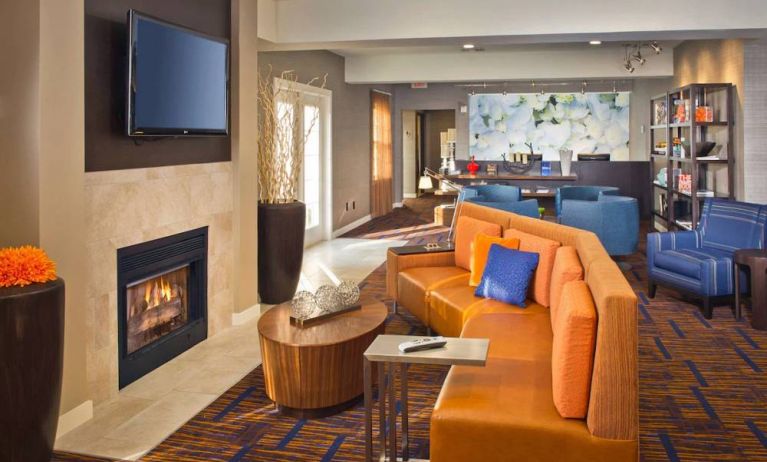 The hotel’s lobby lounge features a fireplace and widescreen TV, plus comfortable seating and coffee tables.