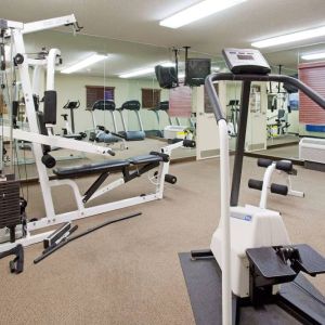 Sonesta Simply Suites Salt Lake City Airport’s fitness center has a diverse array of exercise machines and a television set.