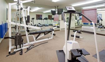 Sonesta Simply Suites Salt Lake City Airport’s fitness center has a diverse array of exercise machines and a television set.