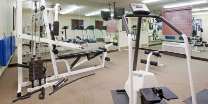 Sonesta Simply Suites Salt Lake City Airport’s fitness center has a diverse array of exercise machines and a television set.