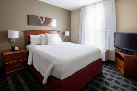 Double bed guest room in Sonesta Simply Suites Seattle Renton, featuring a large window and widescreen television.