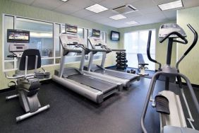 Sonesta Select Seattle Renton’s fitness center is equipped with both free weights and a variety of exercise machines, and has large windows.