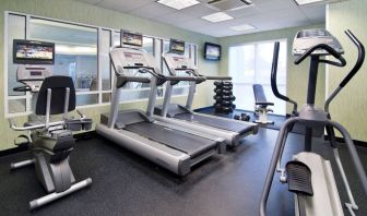 Sonesta Select Seattle Renton’s fitness center is equipped with both free weights and a variety of exercise machines, and has large windows.