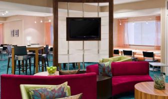 Sonesta Select Seattle Renton’s lobby lounge has comfortable seating, coffee tables, and a wall-mounted TV.