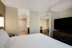 Double bed guest room in Sonesta ES Suites Parsippany Morris Plains, featuring ensuite bathroom and large television.