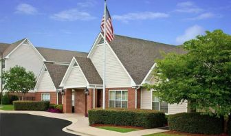 The hotel’s exterior has a fluttering USA flag, and pleasant, well-kept greenery.