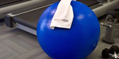 Sonesta ES Suites Atlanta - Perimeter Center North’s fitness center is equipped with gym balls, free weights, and exercise machines for guests to use.