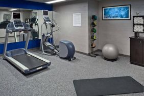 Sonesta ES Suites New Orleans’s fitness center is equipped with gym balls, exercise machines, and plenty of towels.