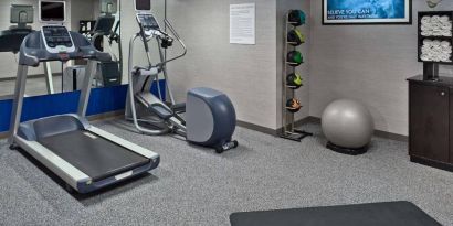 Sonesta ES Suites New Orleans’s fitness center is equipped with gym balls, exercise machines, and plenty of towels.