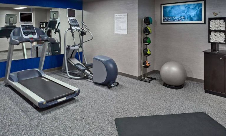 Sonesta ES Suites New Orleans’s fitness center is equipped with gym balls, exercise machines, and plenty of towels.