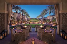 Sonesta Suites Scottsdale Gainey Ranch’s fire pits are surrounded by comfy chairs, with more tables and chairs, and candle-style lights, nearby for outdoor socializing.