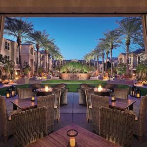 Sonesta Suites Scottsdale Gainey Ranch’s fire pits are surrounded by comfy chairs, with more tables and chairs, and candle-style lights, nearby for outdoor socializing.