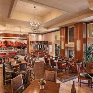 The hotel’s Heart Room Patio serves up breakfast in a setting of high ceilings and toasty fireplaces, with tables of varying sizes and numerous potted plants.