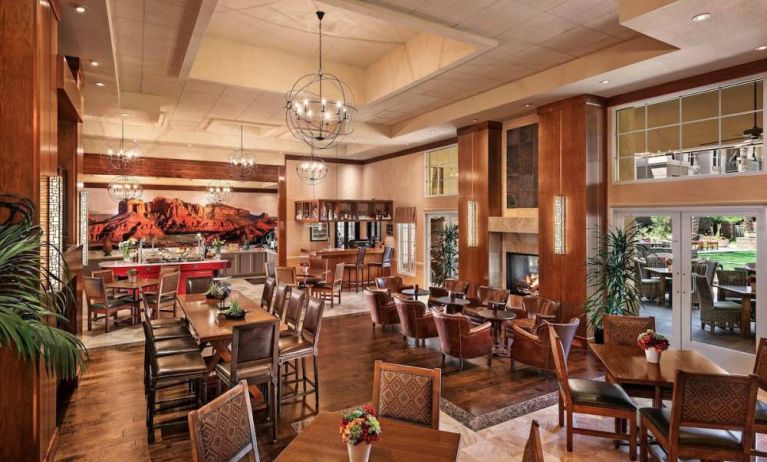 The hotel’s Heart Room Patio serves up breakfast in a setting of high ceilings and toasty fireplaces, with tables of varying sizes and numerous potted plants.