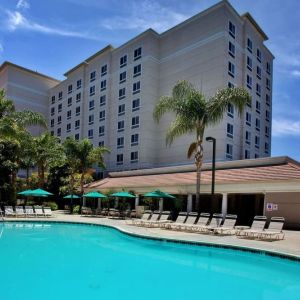 Outdoor pool with pool chairs at Sonesta Anaheim Resort Area.