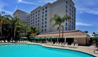 Outdoor pool with pool chairs at Sonesta Anaheim Resort Area.