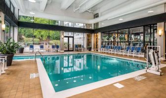 The hotel’s indoor pool includes a lift, has chairs by the side, and large windows to let in plenty of natural light.