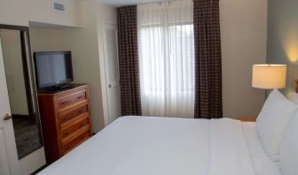 Sonesta ES Suites San Antonio Northwest - Medical Center guest room, furnished with double bed and widescreen television.