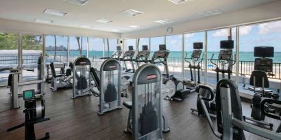 The fitness center in Royal Sonesta San Juan is equipped with a large array of exercise machines, and large windows overlooking the beach.