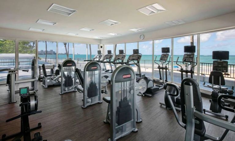 The fitness center in Royal Sonesta San Juan is equipped with a large array of exercise machines, and large windows overlooking the beach.