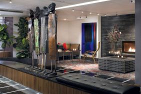 The hotel’s lobby is furnished with stylised sculptures, as well as comfortable seating close to a fireplace.