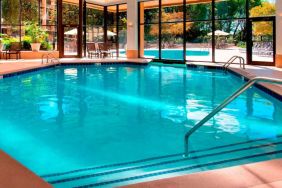 The hotel’s indoor pool has chairs by the side and a direct water link to the outside pool.