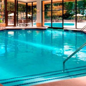 The hotel’s indoor pool has chairs by the side and a direct water link to the outside pool.