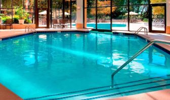 The hotel’s indoor pool has chairs by the side and a direct water link to the outside pool.