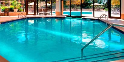 The hotel’s indoor pool has chairs by the side and a direct water link to the outside pool.