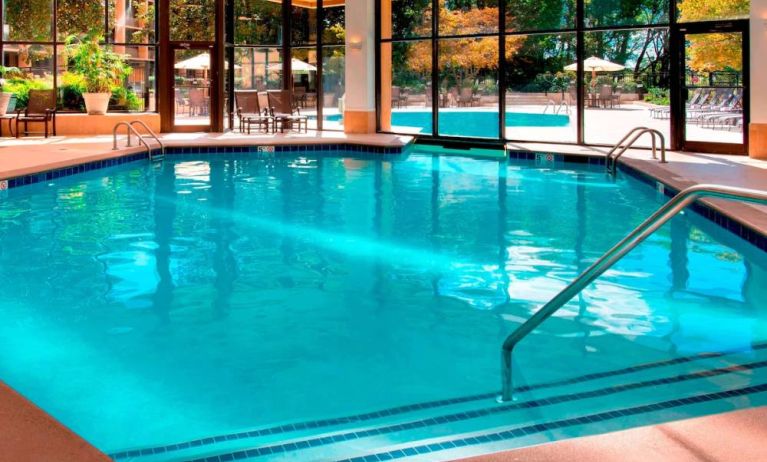 The hotel’s indoor pool has chairs by the side and a direct water link to the outside pool.