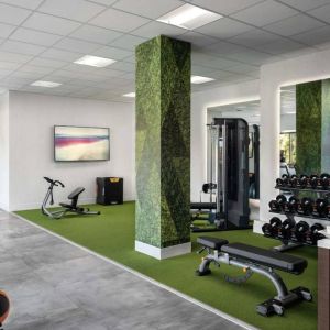 Sonesta Irvine’s fitness center is equipped with both exercise machines and free weights, in addition to gym balls and nature-themed decor.