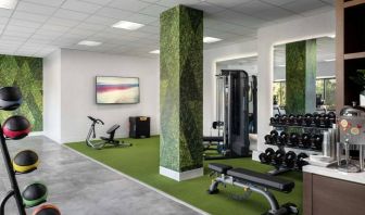 Sonesta Irvine’s fitness center is equipped with both exercise machines and free weights, in addition to gym balls and nature-themed decor.