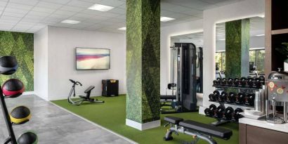 Sonesta Irvine’s fitness center is equipped with both exercise machines and free weights, in addition to gym balls and nature-themed decor.