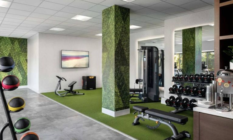 Sonesta Irvine’s fitness center is equipped with both exercise machines and free weights, in addition to gym balls and nature-themed decor.