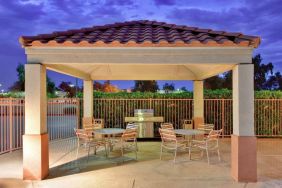 Sonesta Simply Suites Phoenix Tempe’s gazebo features barbecue facilities next to which are tables and chairs where guests can dine and socialize.