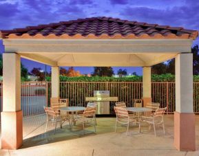 Sonesta Simply Suites Phoenix Tempe’s gazebo features barbecue facilities next to which are tables and chairs where guests can dine and socialize.