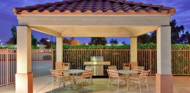 Sonesta Simply Suites Phoenix Tempe’s gazebo features barbecue facilities next to which are tables and chairs where guests can dine and socialize.