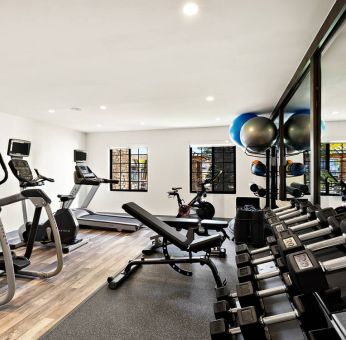 Sonesta ES Suites Denver South - Park Meadows’ fitness center is equipped with gym balls, free weights, and various exercise machines for guests to use.