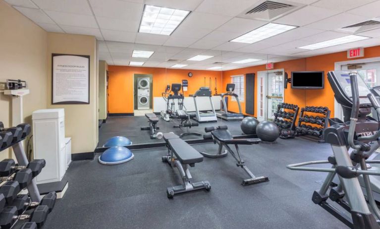 Sonesta ES Suites Atlanta - Perimeter Center’s fitness center has both free weights and a range of exercise machines, plus benches and a wall-mounted TV.