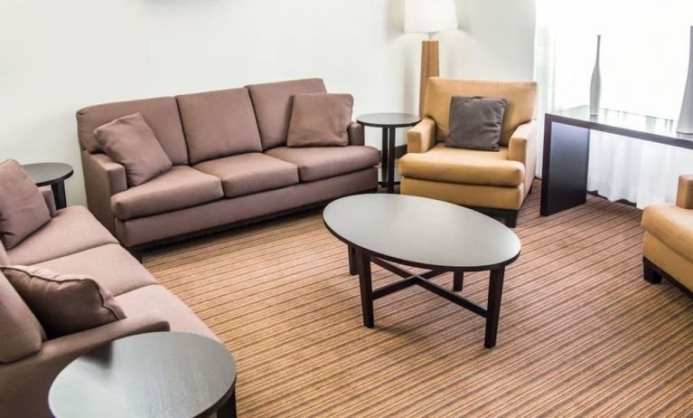 Lobby and lounge ideal for coworking at Sleep Inn Tinley Park.