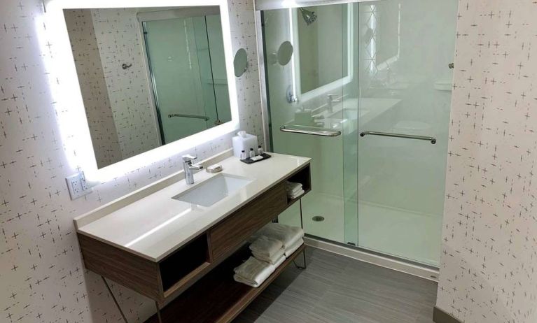 Guest bathroom in Sonesta Columbus Downtown, with shower, sink, and mirror.