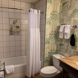 Guest bathroom in Royal Sonesta Portland Downtown, including sink, mirror, lavatory, and bath.