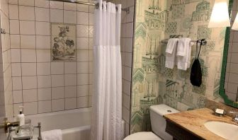 Guest bathroom in Royal Sonesta Portland Downtown, including sink, mirror, lavatory, and bath.