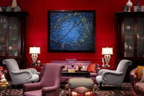 The lobby lounge in Royal Sonesta Portland Downtown is furnished with comfortable armchair and sofa seating, coffee tables, and art on the wall.