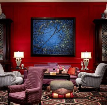 The lobby lounge in Royal Sonesta Portland Downtown is furnished with comfortable armchair and sofa seating, coffee tables, and art on the wall.