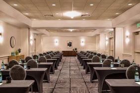 Royal Sonesta Portland Downtown meeting room, with tables arranged in a classroom format and seating for dozens of attendees.