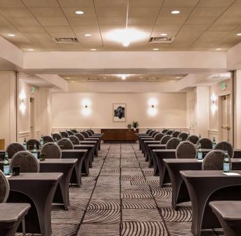 Royal Sonesta Portland Downtown meeting room, with tables arranged in a classroom format and seating for dozens of attendees.